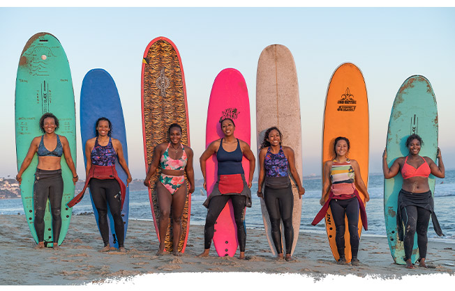 surfers with their surfboards